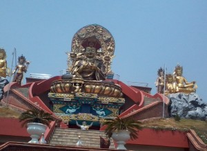 Golden statue of buddha in White gumba