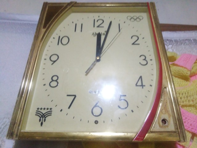 Ancient wall clock with alarm