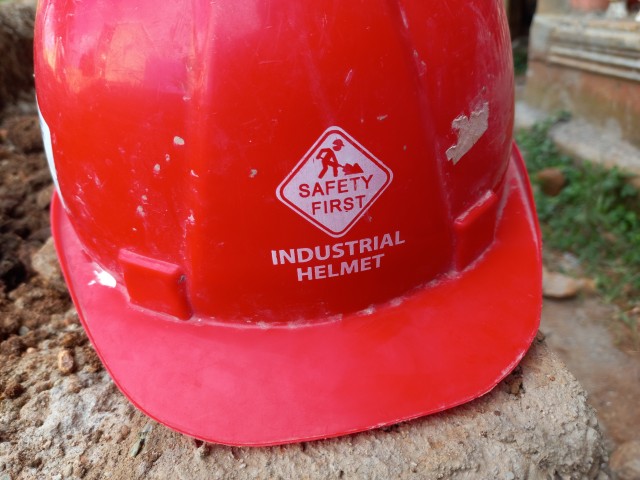 Red industrial safety helmet